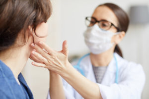 Provider giving facial exam