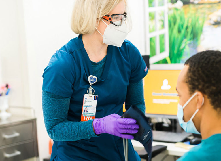 nurse taking a patient's blood pressure