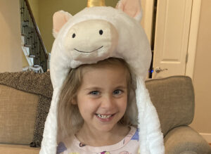 little girl with unicorn hat