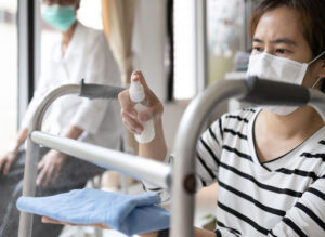 infection control woman cleaning walker